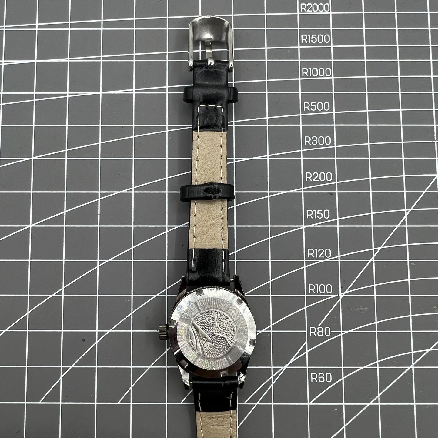Seagull black case ladies manual watch with gold nail markers, shock-resistant for everyday durability.