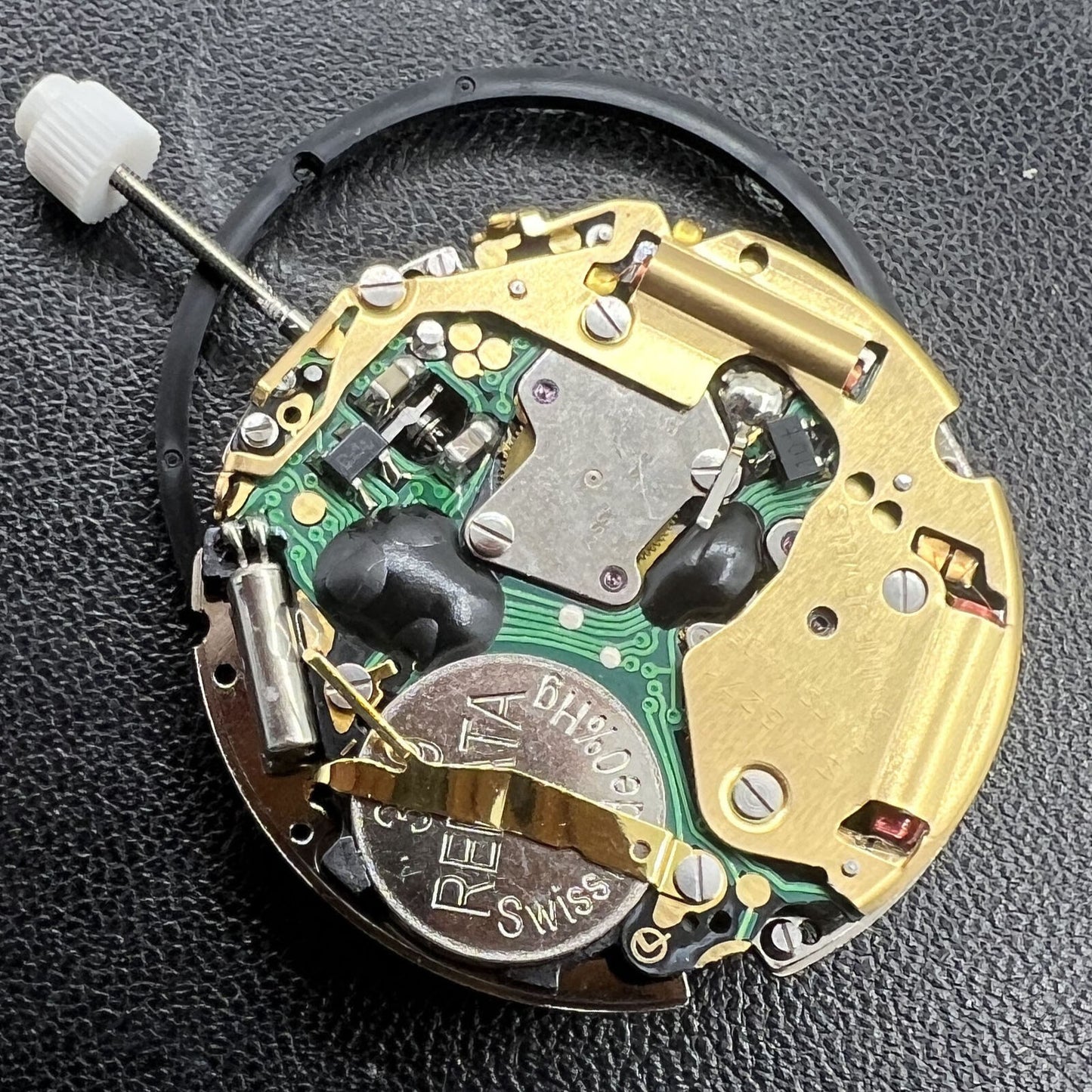 Golden ISA 8271 quartz watch movement with multifunctional date display at 6 o'clock by ISA.