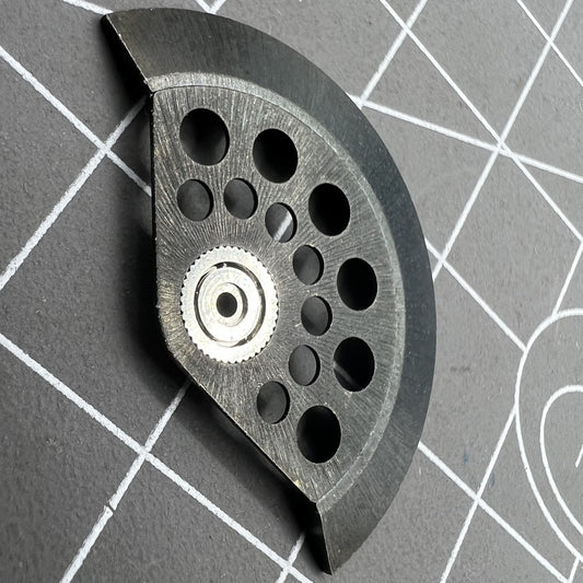 Black hollow rotor oscillating weight with ball bearing for 7750 series watch movement efficiency.