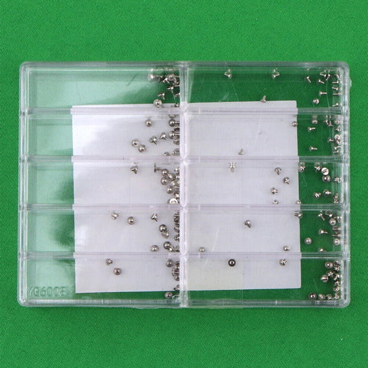 Precision screw assortment for watch movements, various sizes for repair and maintenance.