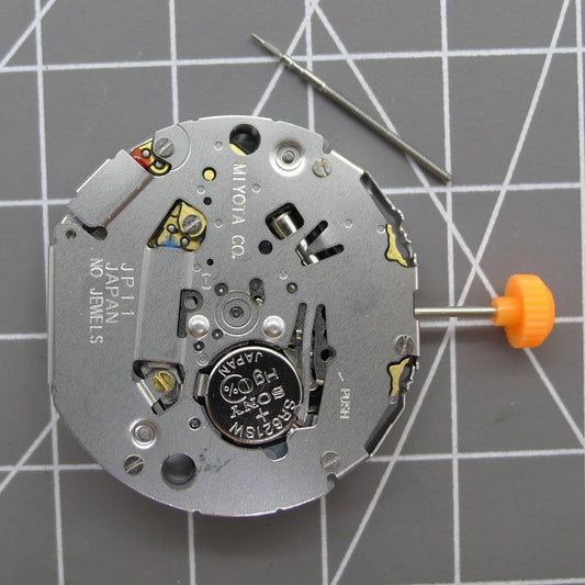 Japan Miyota JP11 quartz watch movement with date display at 3 o?clock, precision timekeeping by Miyota.