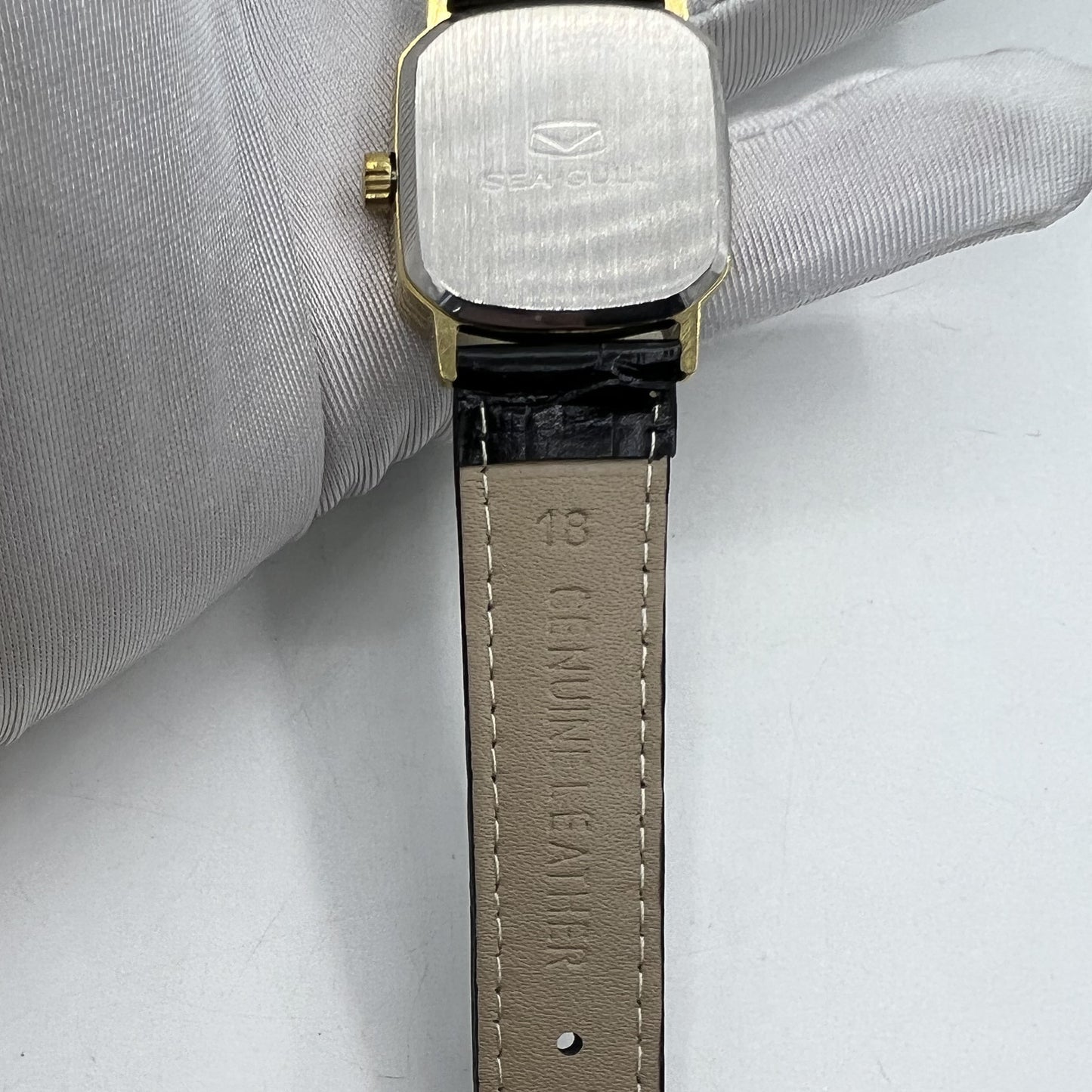 Seagull 28mm ladies watch with golden square case, manual movement, elegant style for sophisticated wear.