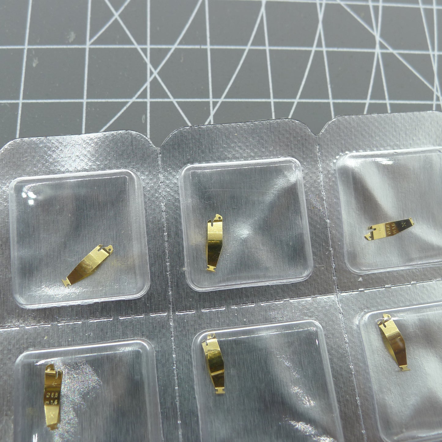 Set of 3 ETA brand battery fixing plates for quartz watch movements, precise and durable fit.