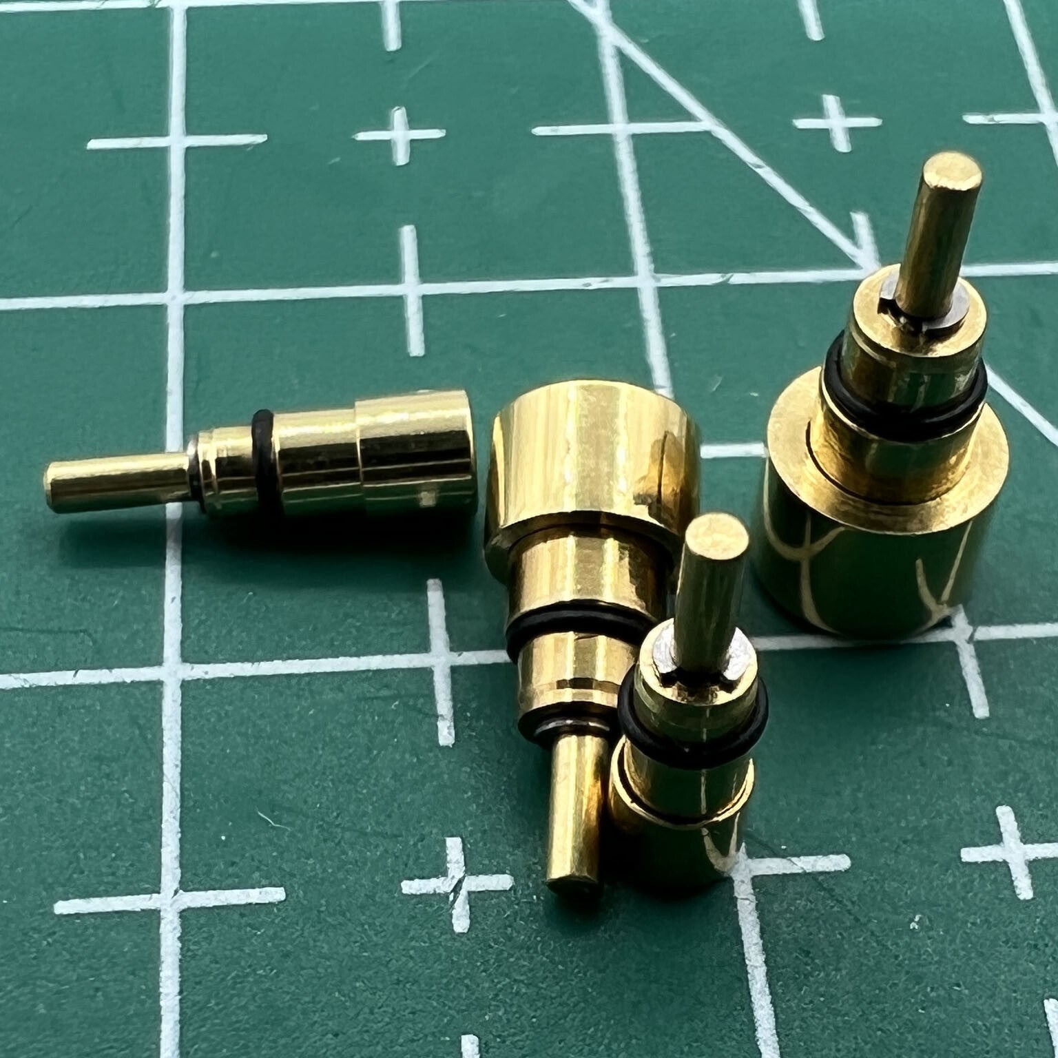 Golden stainless steel watch accessory by Wholesale Watch, classic pusher drive design available in 13 sizes.