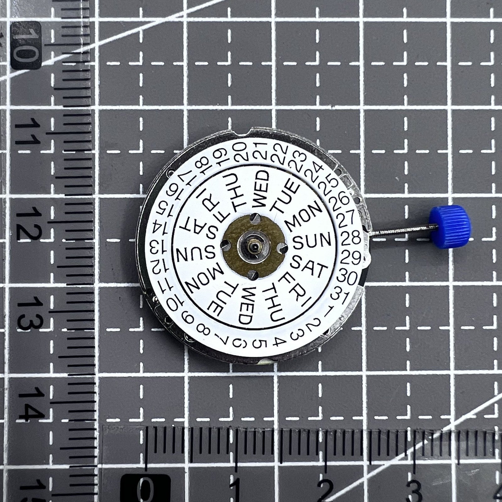 Swiss ISA 1198 Quartz watch movement with 3 hands and English day-date display for precise timing.