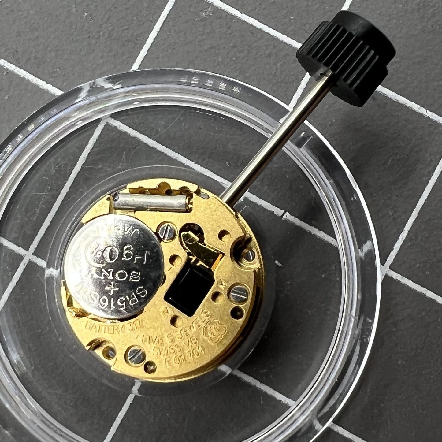 Swiss Made ETA E01.701 quartz watch movement with 2 hands, precise timekeeping by ETA brand, ideal for watch repairs.