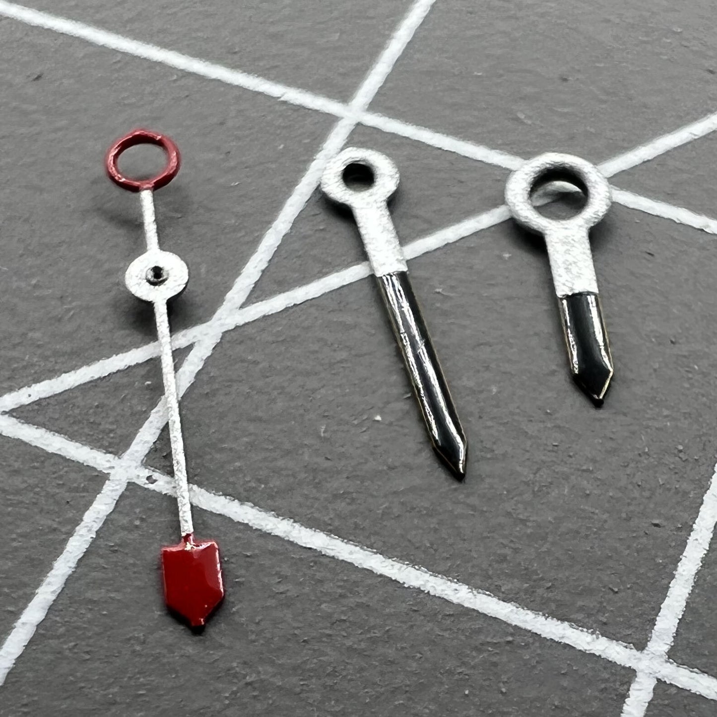 Silver and black watch hands for Miyota 2035 and 2115 movements, stylish and precise.