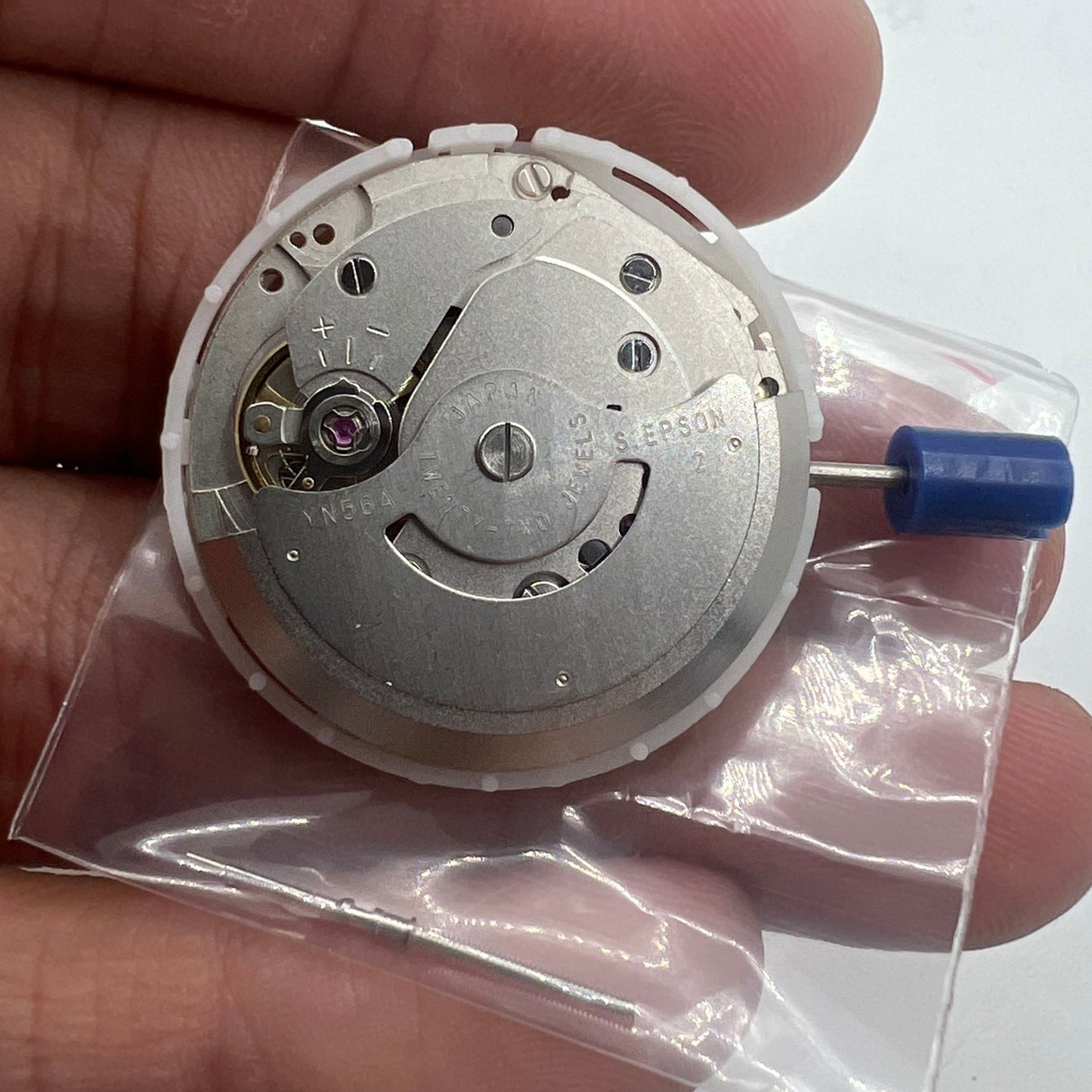 Epson YN56 watch movement displaying mechanical date and day function, precision Japan design.