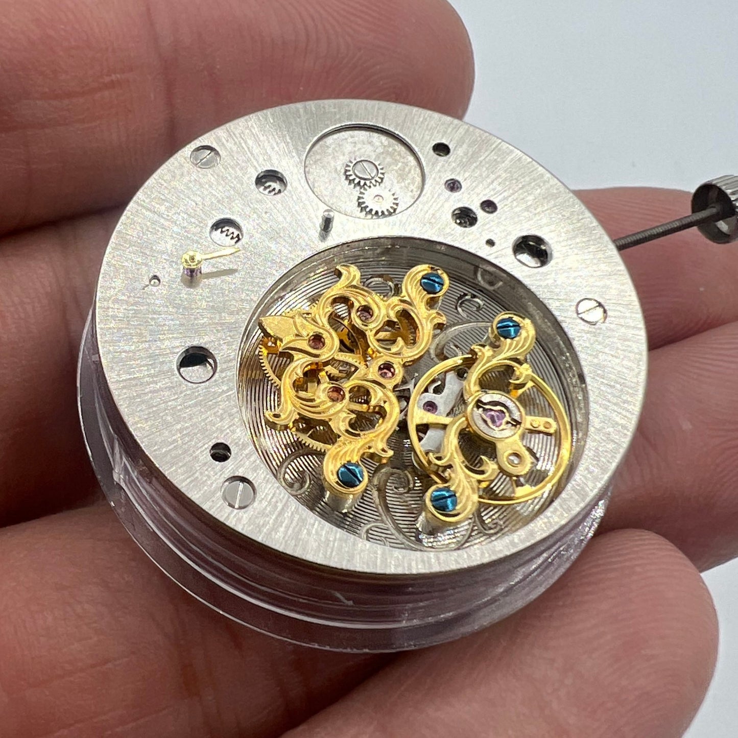 Multifunctional automatic watch featuring mechanical movement and kinetic energy tourbillon.