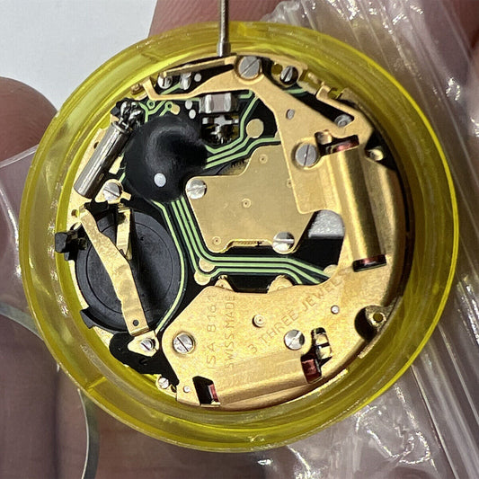 ISA 8161 golden watch part with Swiss quartz movement and 3 hands for precise timekeeping.