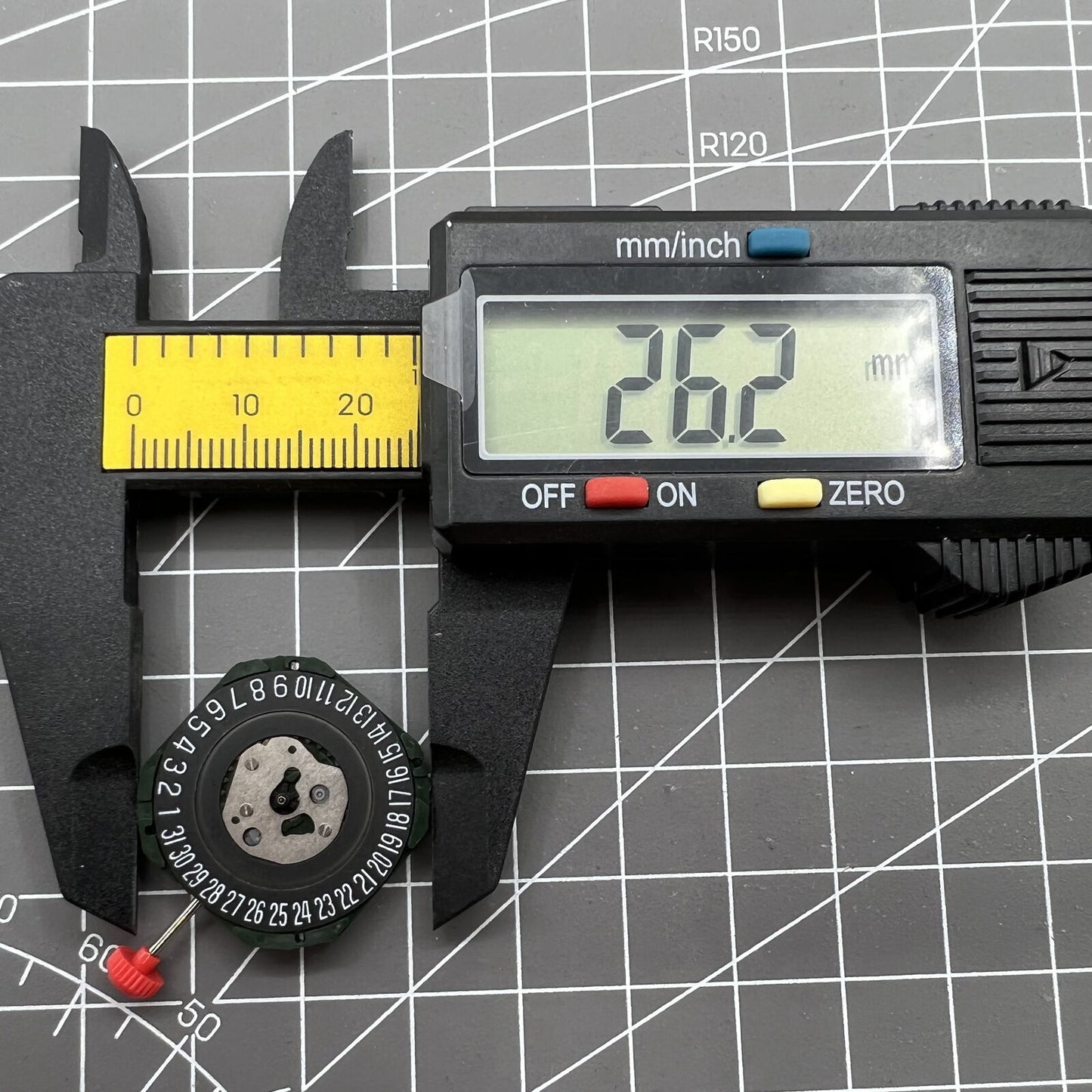 Black dial watch with Miyota 2315 quartz, 3 hands, date at 6, and watch stem detail.
