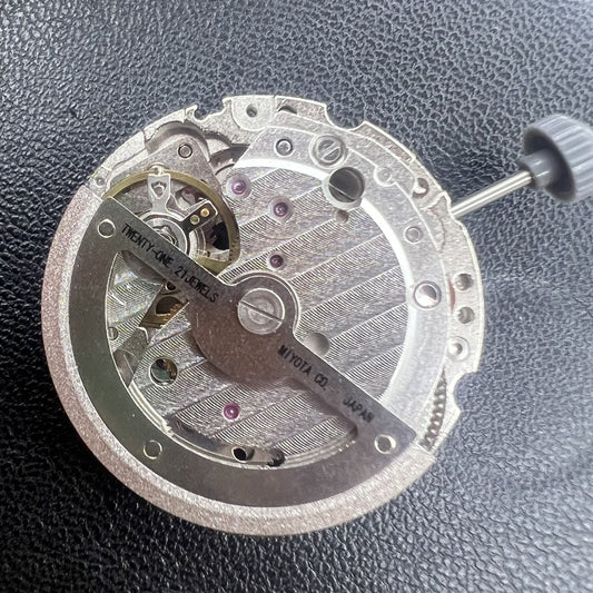 Silver hollow watch part with Miyota 8245 automatic mechanical movement, 2-hand design for precise timekeeping.