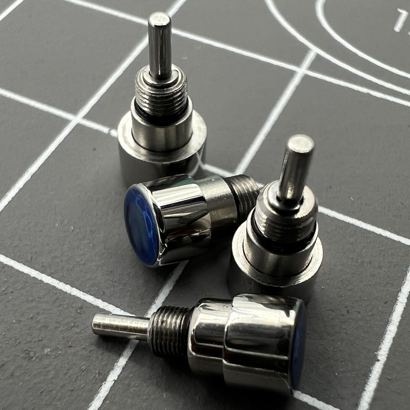 Silver stainless steel watch accessory set, 14 pieces, 7 sizes for classical pusher drive adjustments.