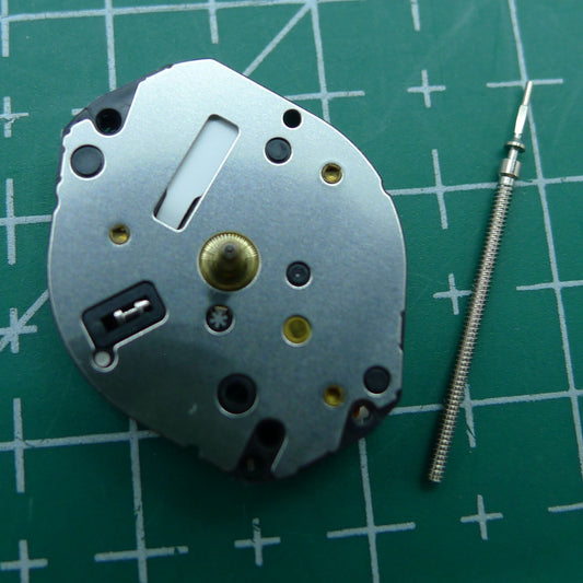 Hattori TMI Y121 quartz watch movement showing detailed mechanical components for precise timekeeping.