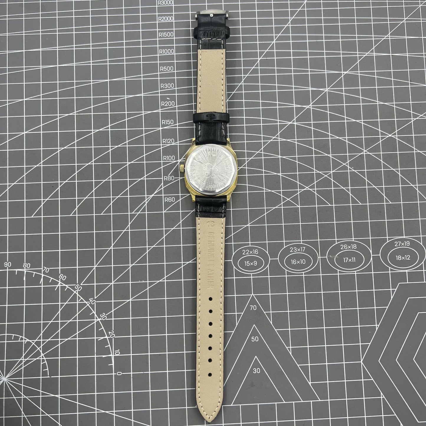 Black Dandong manual mechanical watch with 17 jewels, single calendar, and golden dial for stylish, precise timekeeping.