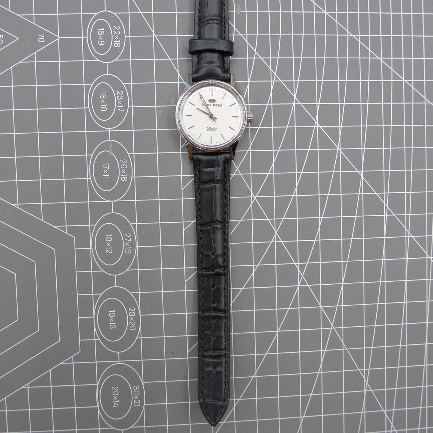 Beijing 31mm manual mechanical watch with silver case and double rhomb dial, showcasing classic Chinese craftsmanship.