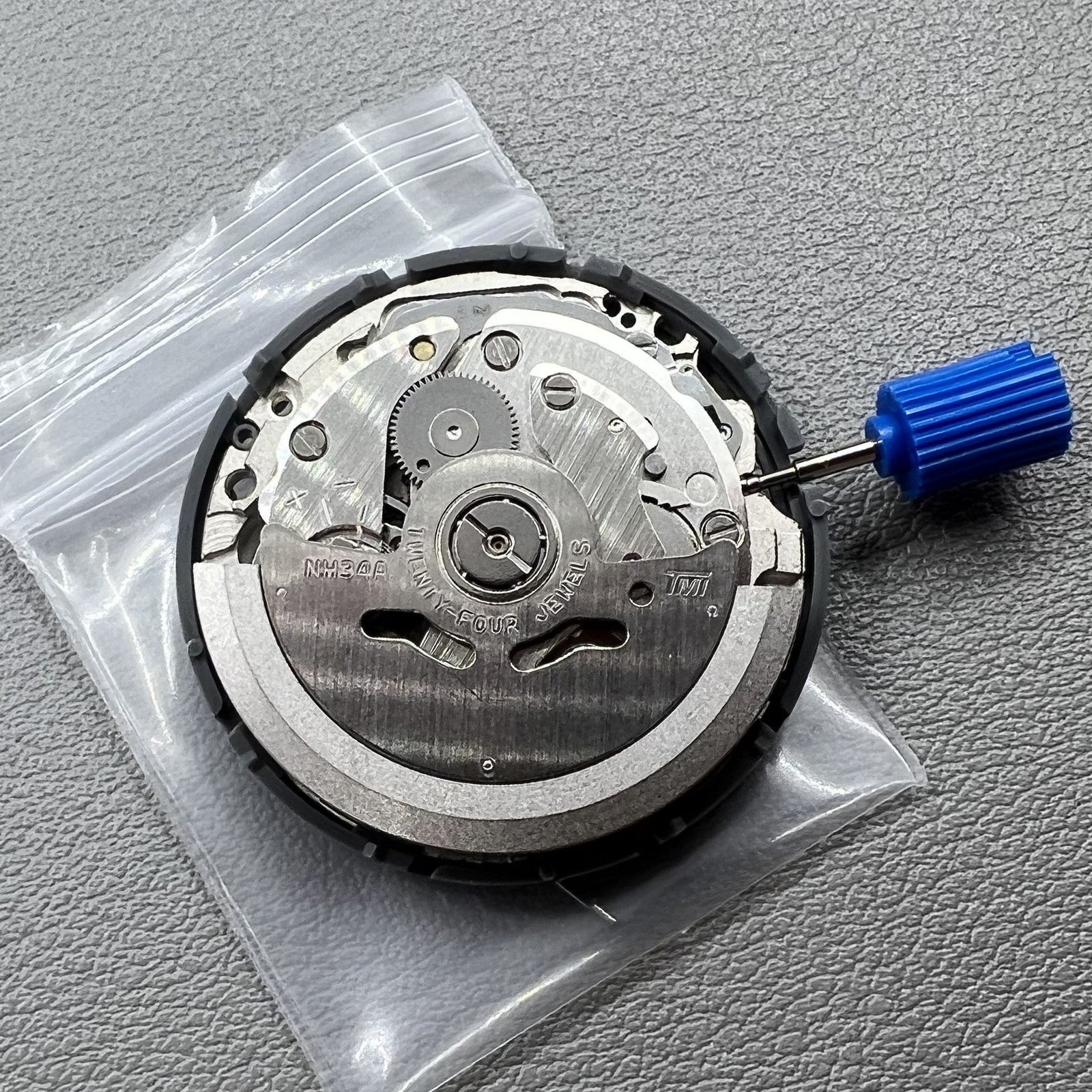 Seiko NH34 automatic GMT watch movement showcasing hacking seconds for precise timekeeping.