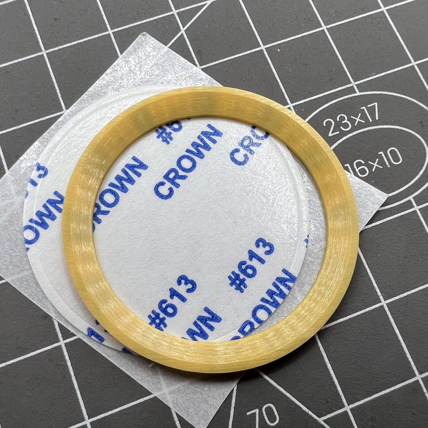 38mm ceramic Slope GMT bezel ring with black font for SUB007 watch against vibrant yellow background.