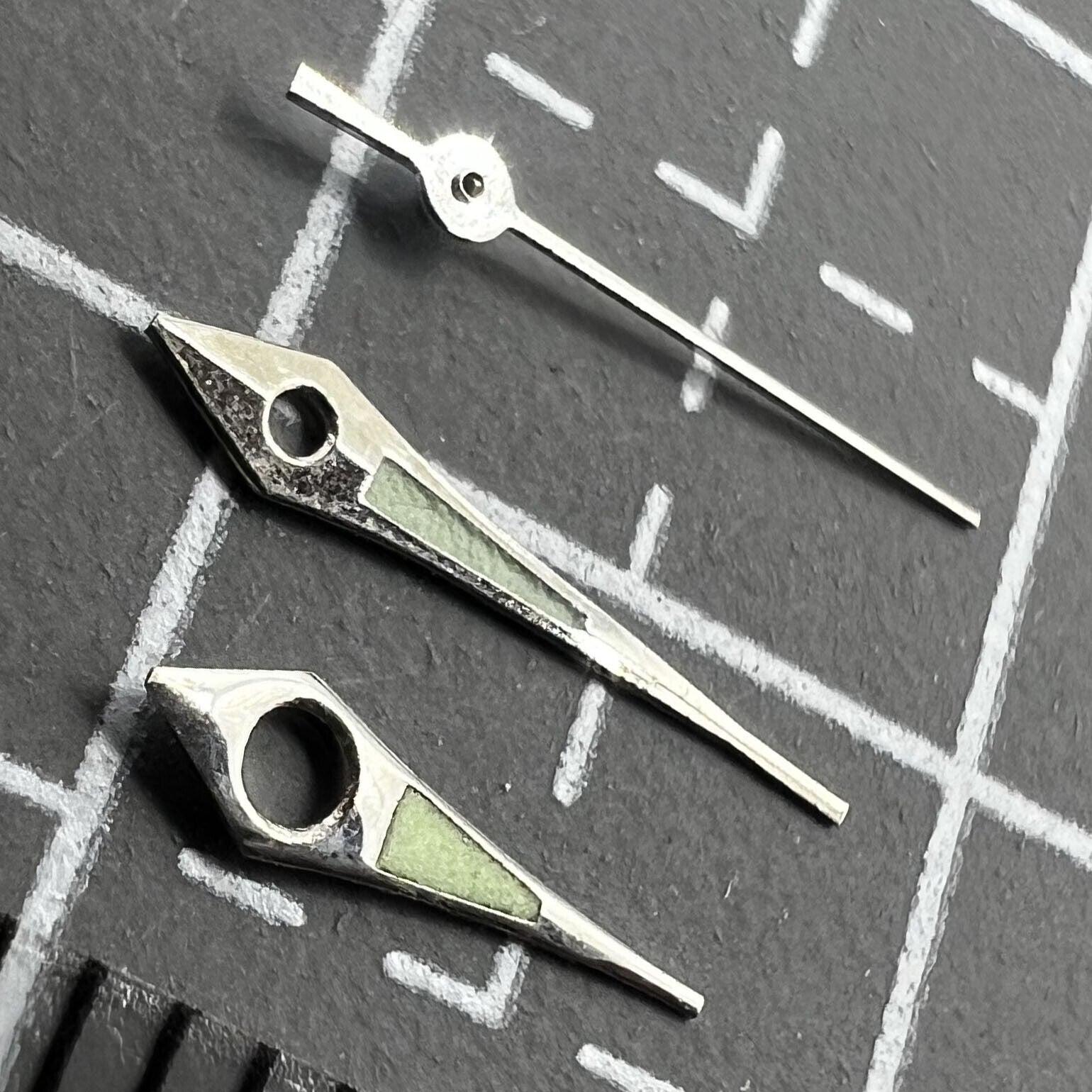 11mm Arrow shape watch hands with silver trim and green lume for Miyota 2035, 2115, 2105 movements.