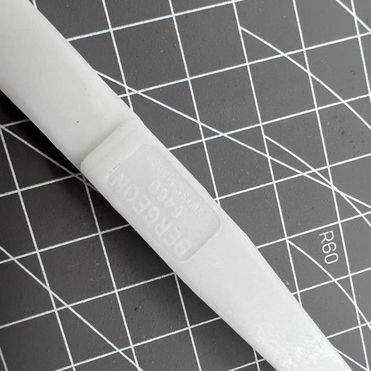 Bergeon 6460 Swiss Made plastic battery tweezer for precise watch battery handling and replacement.