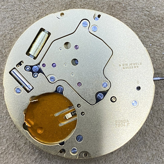 Swiss Made Ronda 7004P quartz watch movement with gold-gilted finish for precise timekeeping.