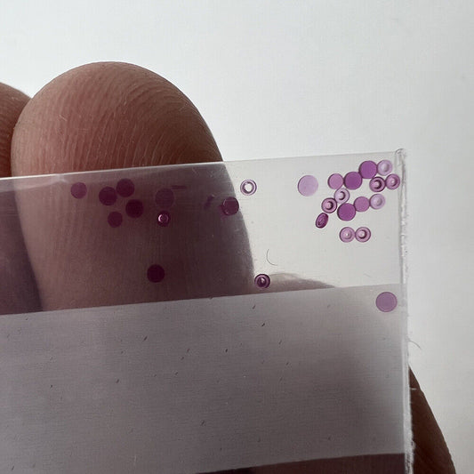 Red gemstone top cap jewels for watch repair, 100pcs replacement parts for precision timing.