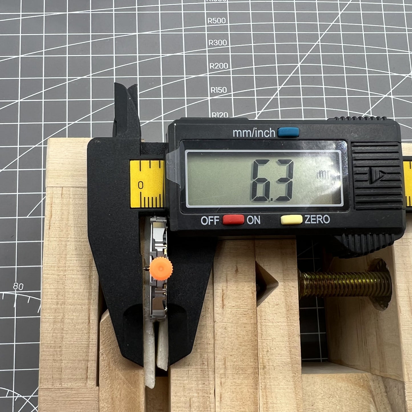 Miyota JS25 Japan quartz watch movement showing small seconds at 3, 6, 9 o'clock and date window at 3.