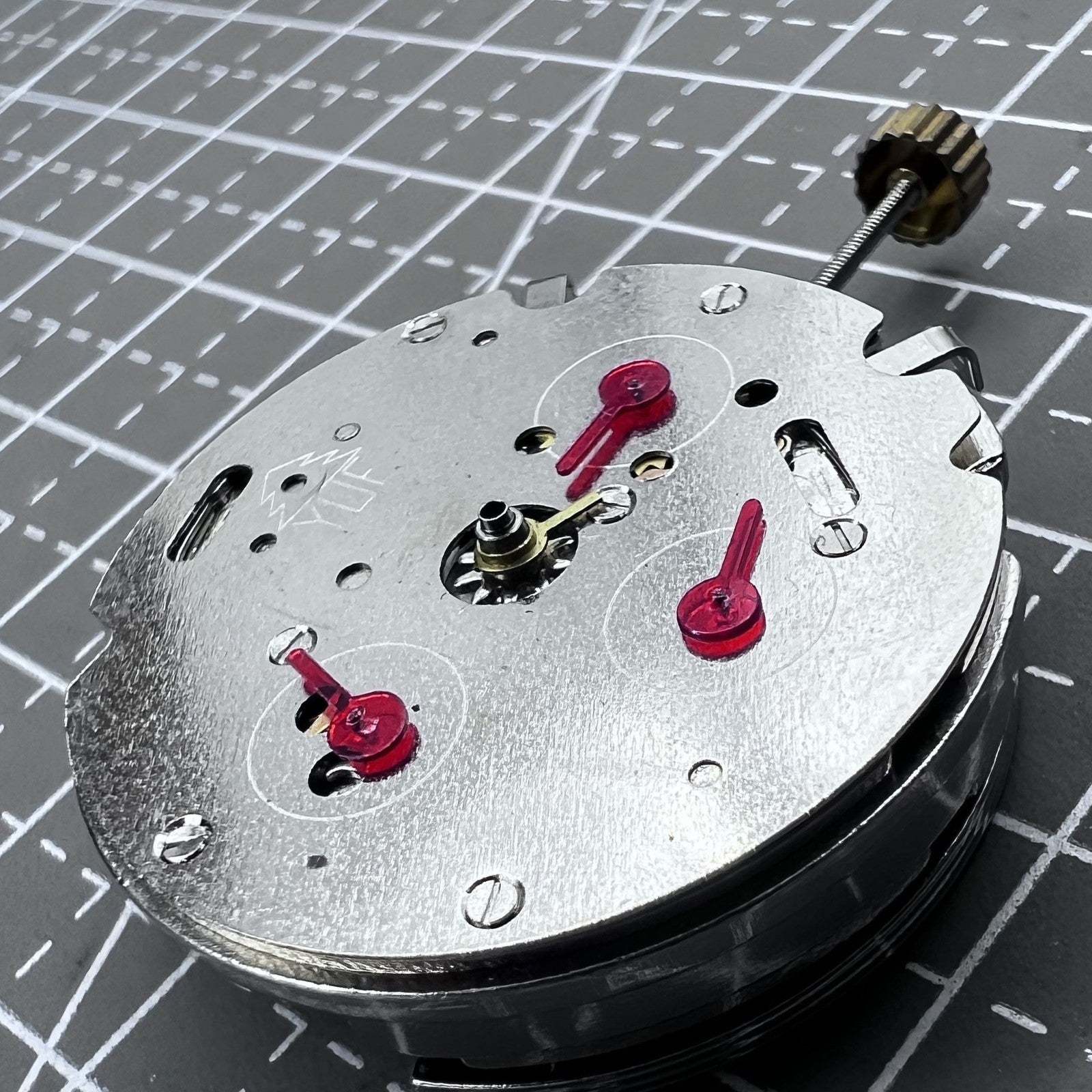 Dandong 7120 automatic watch accessory displaying mechanical movement with 3 large and 6 smaller hands for precision.