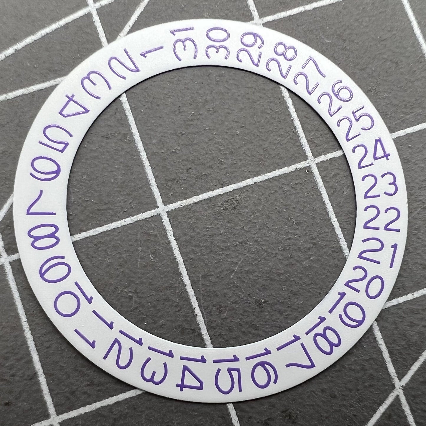 Light purple character disk date wheel for Miyota NH35 NH36 watches with white background.