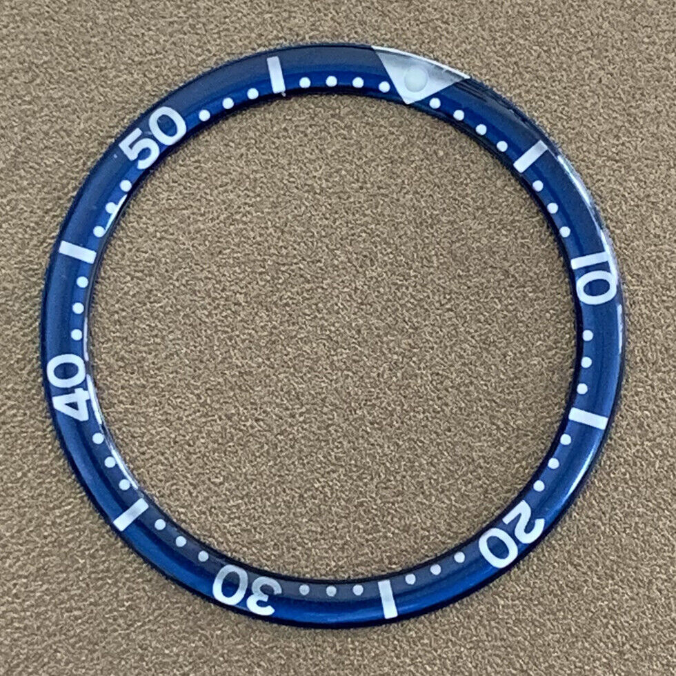 White font 39mm aluminum bezel insert with circular arc bevel for watch customization.