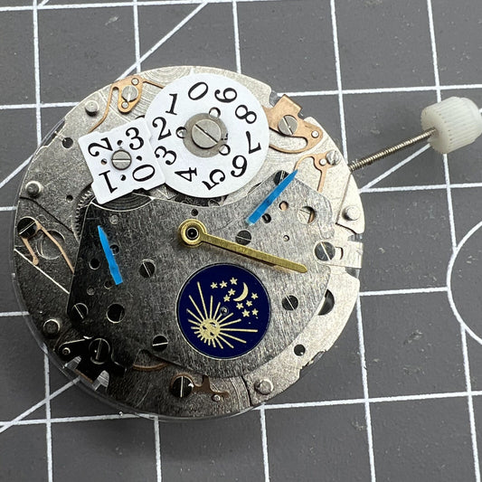 Mechanical automatic watch accessory featuring multi-function 3 hands and big date display at 12, branded for precision.