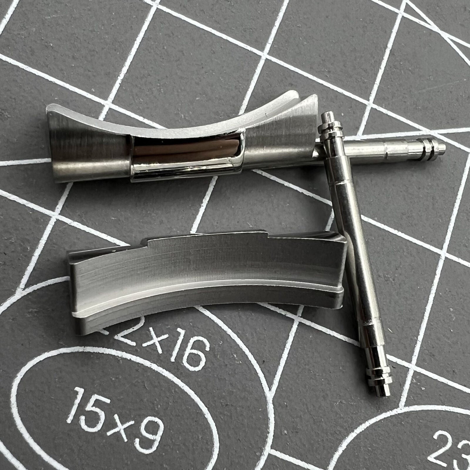 Silver curved end links for Daytona watch band 20/21mm, enhancing fit and style by BrandName.