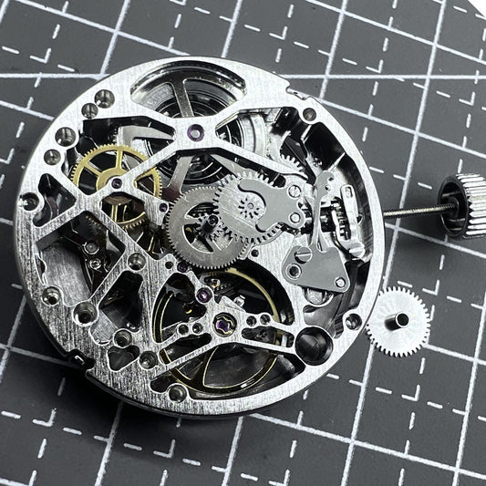 Tianjin Silver hollow carved watch with 24 jewel automatic mechanical movement, elegant craftsmanship.