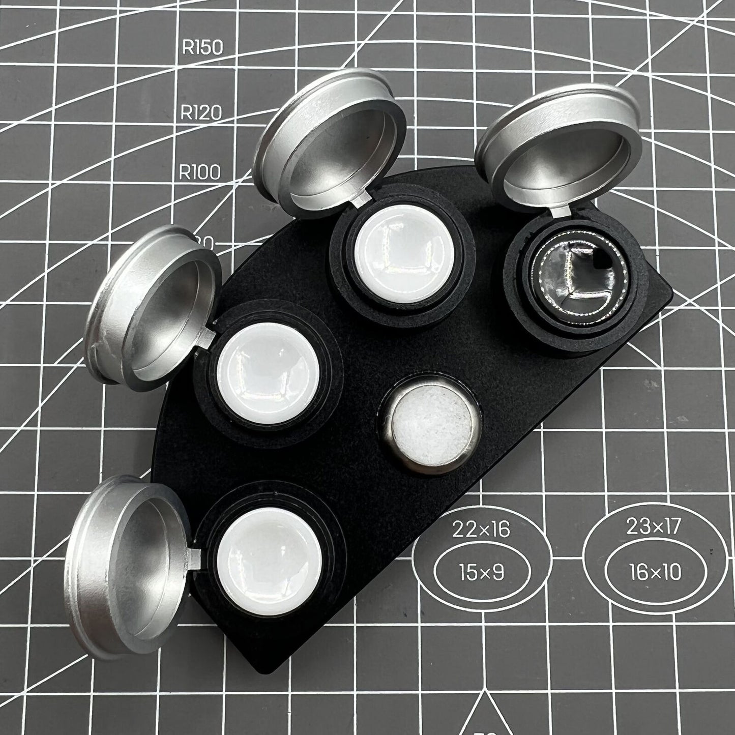 Die-cast alloy oil cup stand with 4 containers and black ceramic inserts for watch maintenance.