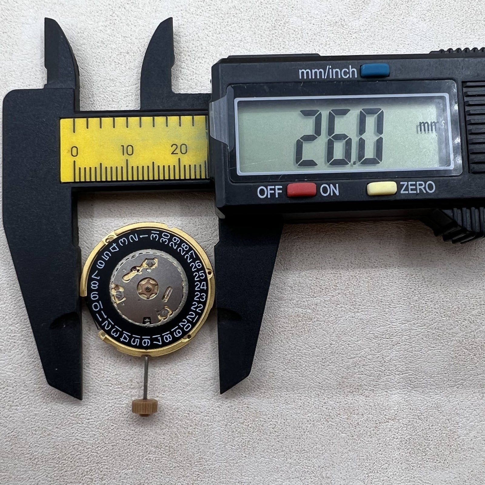 Swiss Ronda 6003.D quartz watch movement with black dial, 3 hands, and single calendar for precise timekeeping.