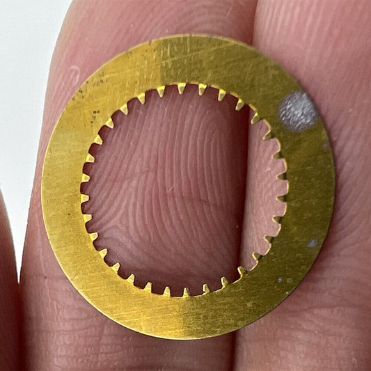 Black date disk showing numbers for Ronda 785 quartz watch movement, date displayed at 3 o'clock position.