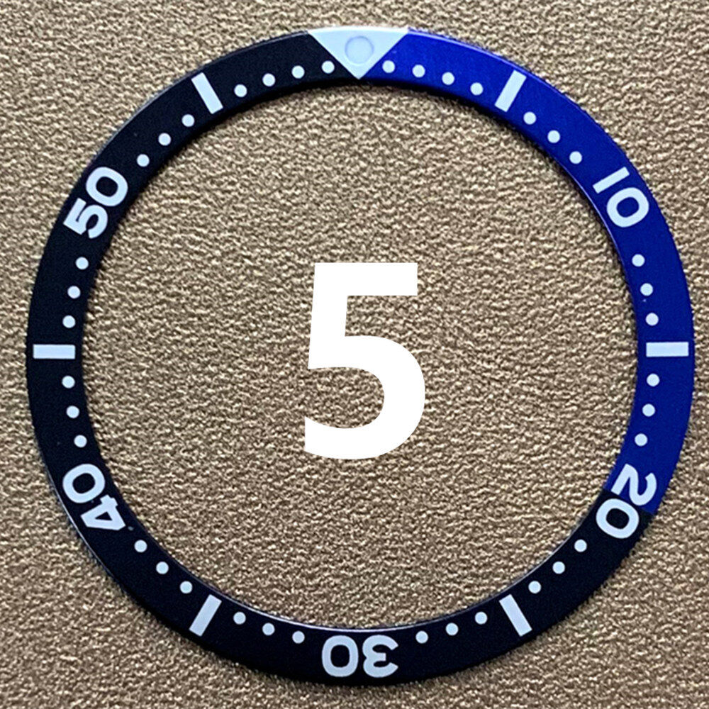 Red, blue, and black aluminum bezel insert for 39mm/32mm watch, enhancing style and durability.