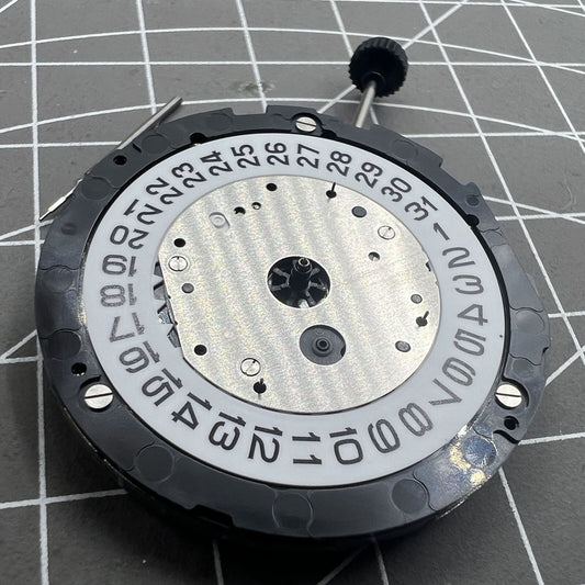 Miyota 6S20 quartz watch movement with date at 3, three hands, small seconds at 6 and 9, precision timekeeping.