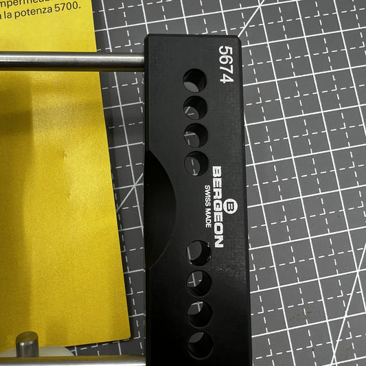 Swiss Bergeon 5674 watch case vice with vise jaws holder for precise watch repair tasks.