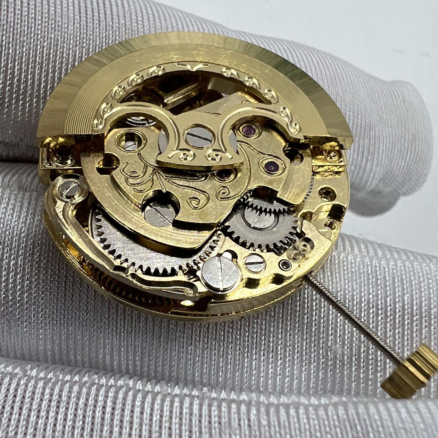 Golden 26.5mm 7120 automatic mechanical watch movement featuring carved hollow design for precision watchmaking.