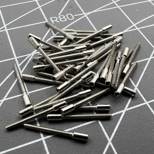 100-piece set of 0.9mm watch winding stem extensions for precise watch repair and customization.