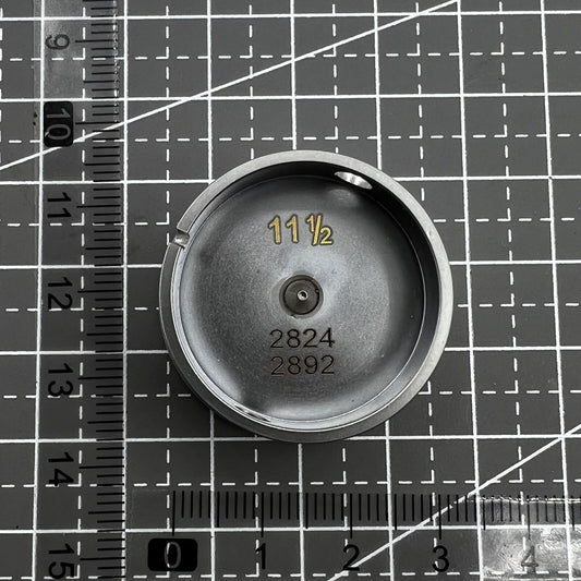 Watch movement holder for ETA 2892/2824, secure center screw design, essential watch repair tool.