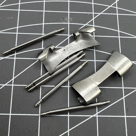 22X9mm stainless steel curved end links with spring bars for secure watch band attachment.