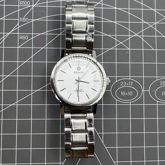 China Baihua 37mm manual mechanical watch with silver dial and 19-jewel shock-resistant movement.
