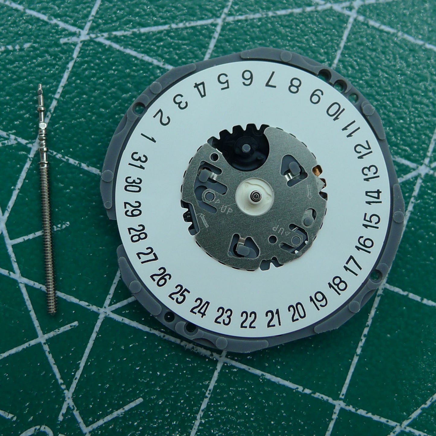 Hattori Epson TMI VJ34 quartz watch movement with date at 6, Japan-made precision component.