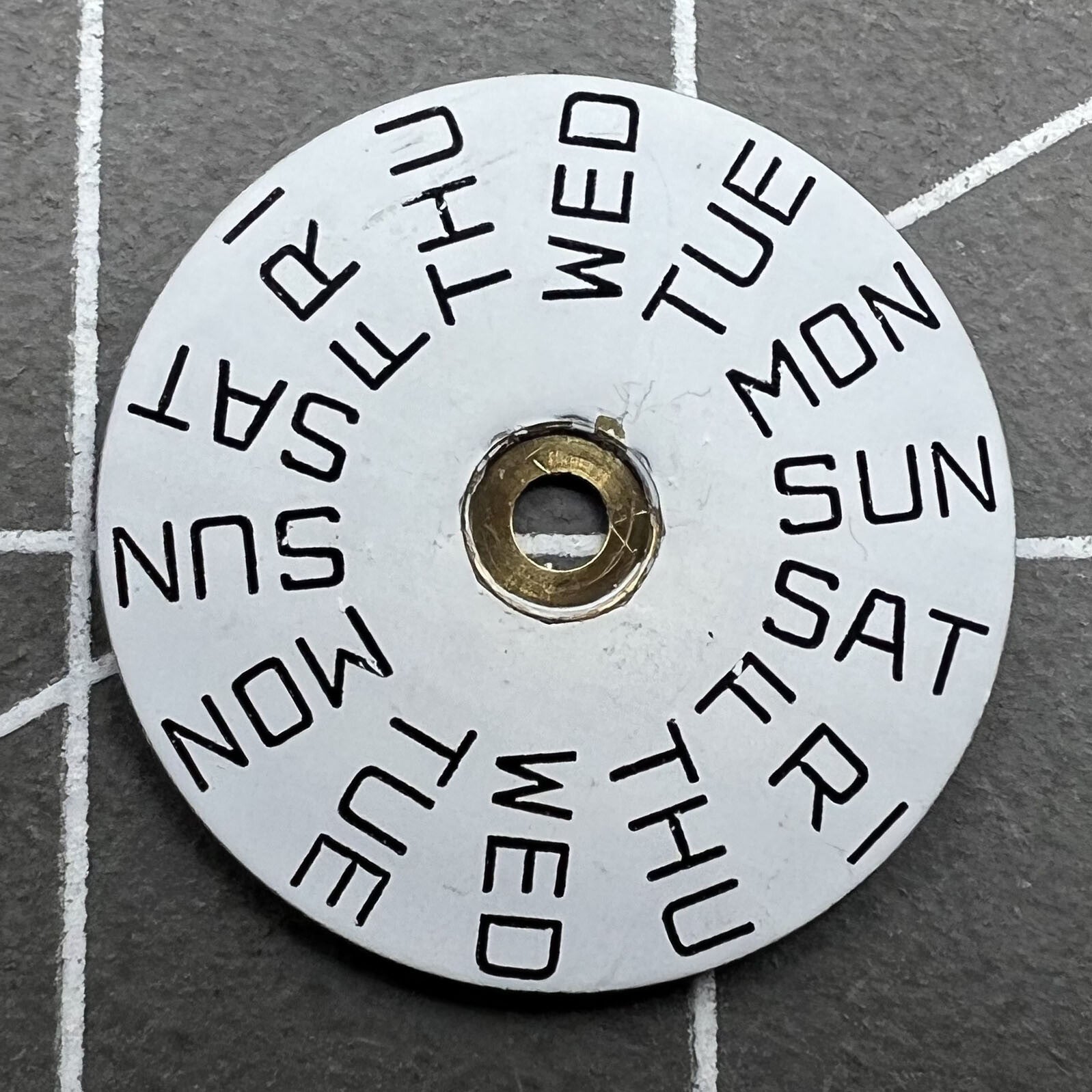 White Week disk wheel for ISA 307 movement, essential watch accessory for precise timekeeping.