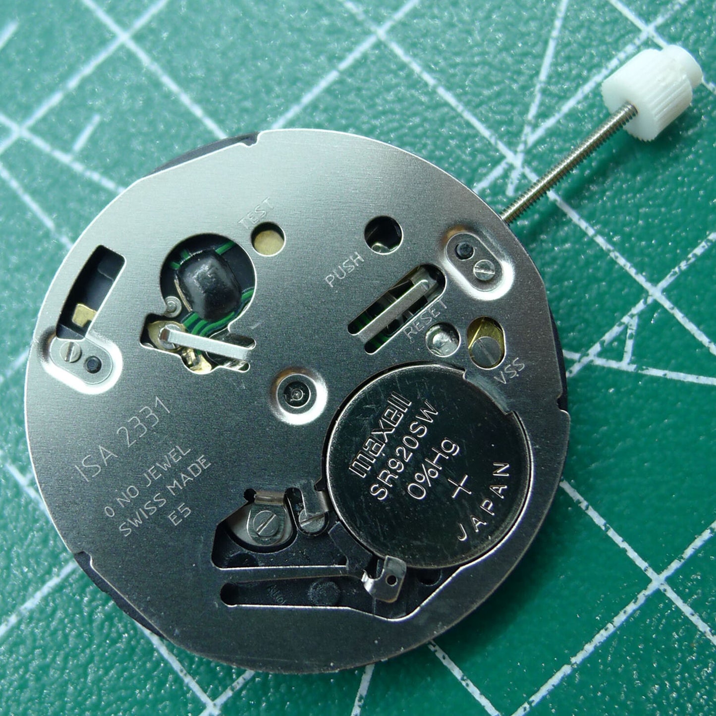 Swiss ISA 2331 black dial quartz watch part with date at 6, ideal for repairs and custom watch builds.