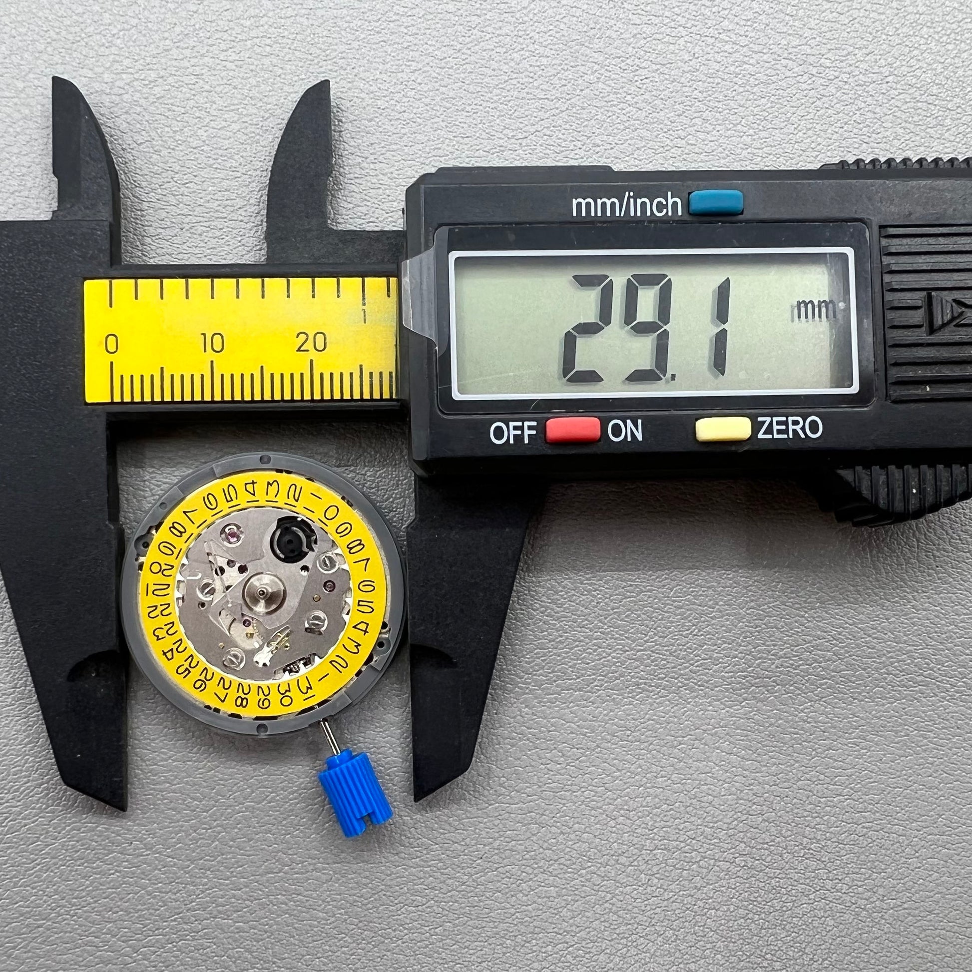 Seiko NH35 automatic watch movement with dark yellow disk, precise mechanical timekeeping by Japan.