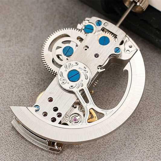 Silver rectangular bare balance wheel watch movement by Asian, model LG0807, automatic mechanical design.