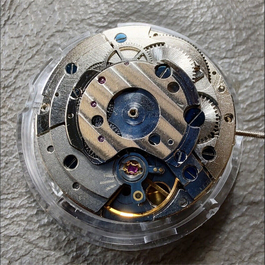 Asian automatic mechanical watch with no rotor, oscillating weight, small second at 9 o'clock
